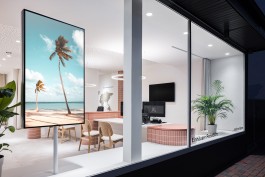 Reisebüro Einhausen Innenarchitektur Design - Blick durch Schaufenster mit Werbedisplay und Pflanzen 